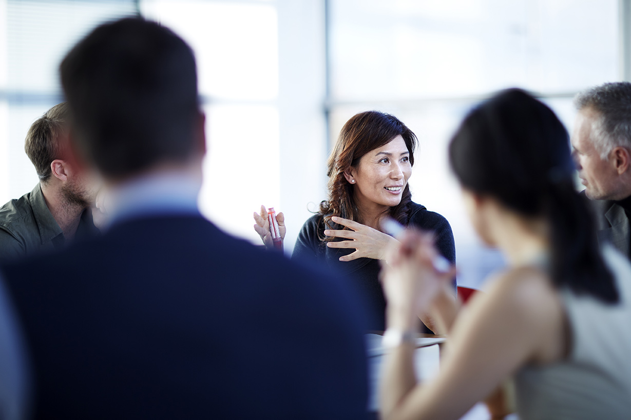 Woman speaking in a team meeting